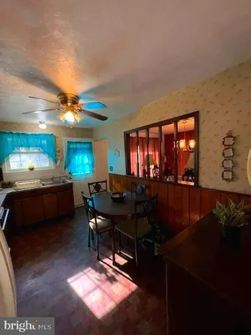 a living room with furniture a rug and a flat screen tv