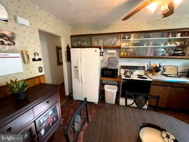 816 Wilson Road Wilmington, DE 19803 - Photo 9 of 20 a kitchen with stainless steel appliances granite countertop a refrigerator and a stove