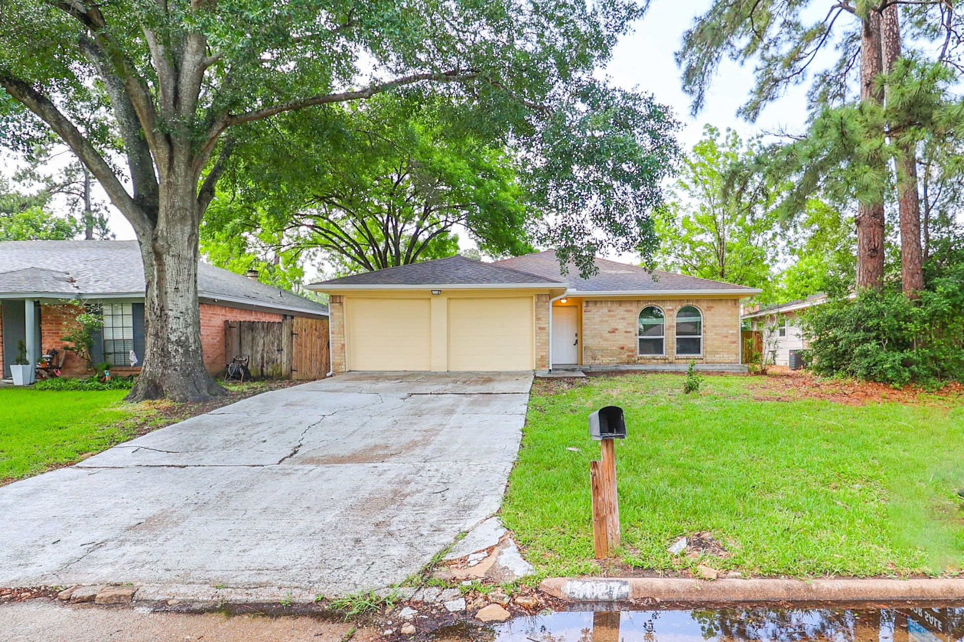 5027 Monteith Drive Spring, TX 77373 - Photo 27 of 28 a front view of a house with a yard and tree