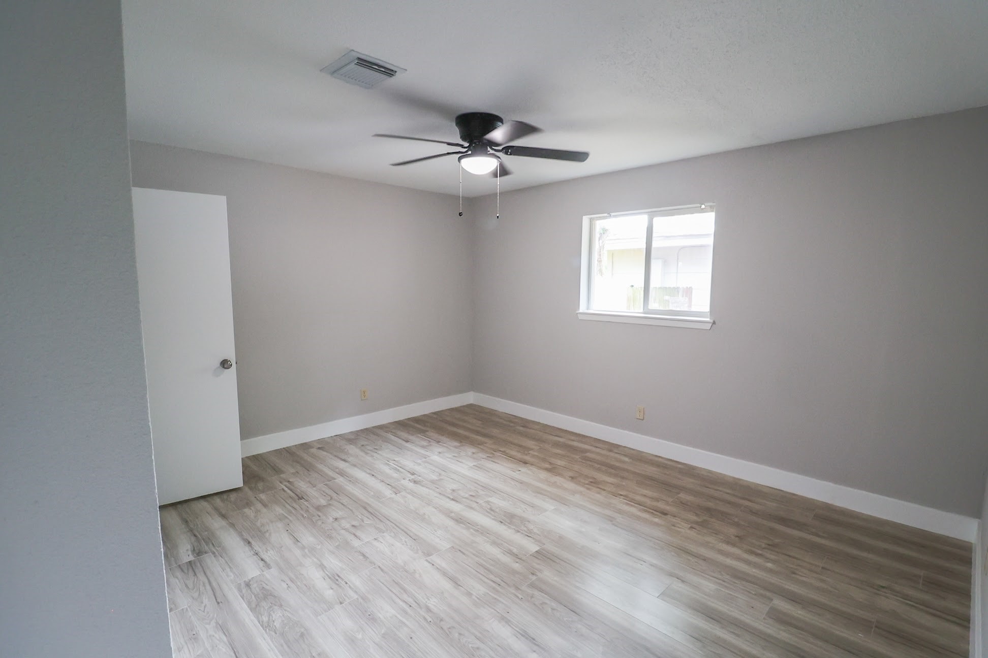 5027 Monteith Drive Spring, TX 77373 - Photo 3 of 28 wooden floor in an empty room with a window