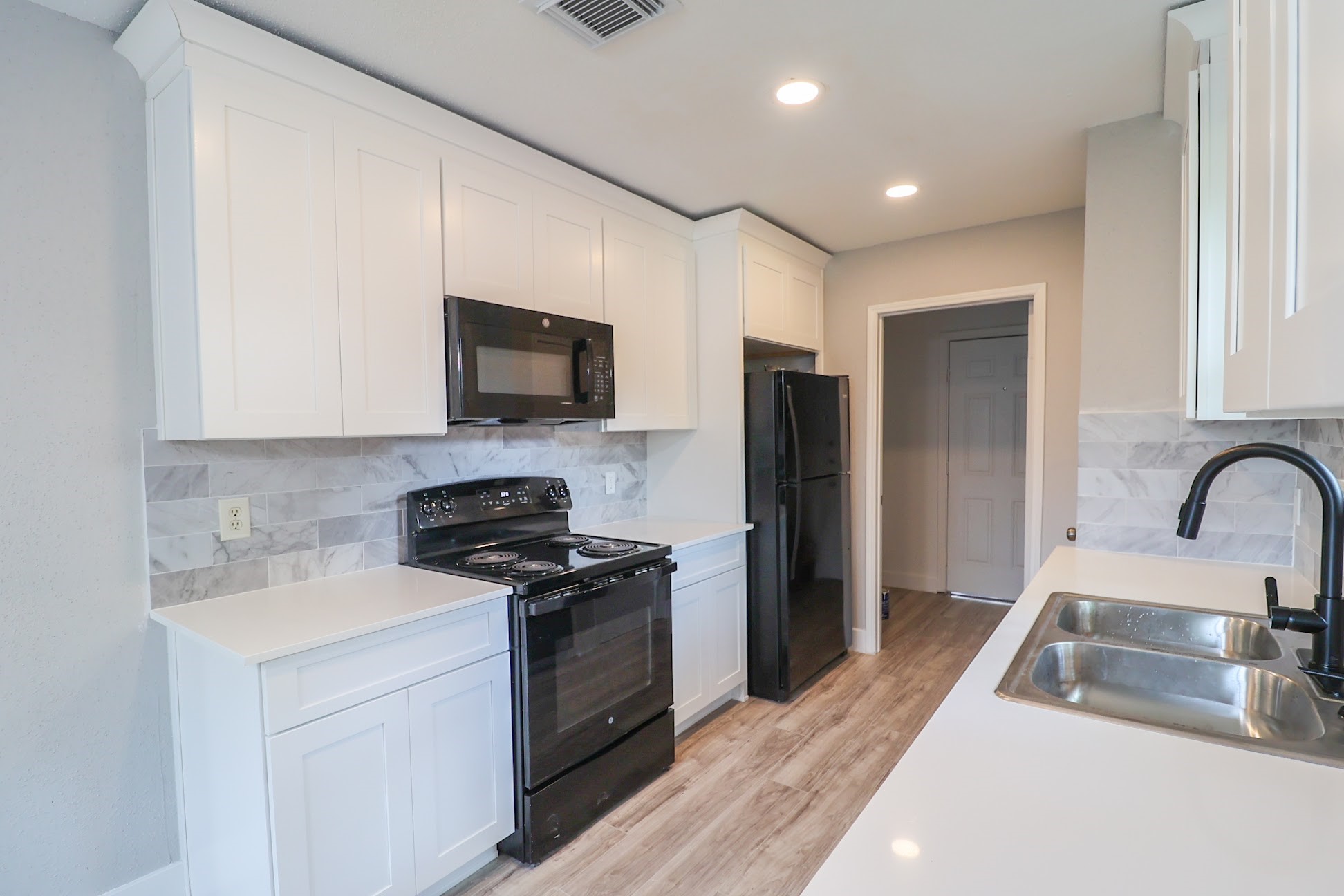5027 Monteith Drive Spring, TX 77373 - Photo 8 of 28 a kitchen with stainless steel appliances granite countertop a sink stove and refrigerator