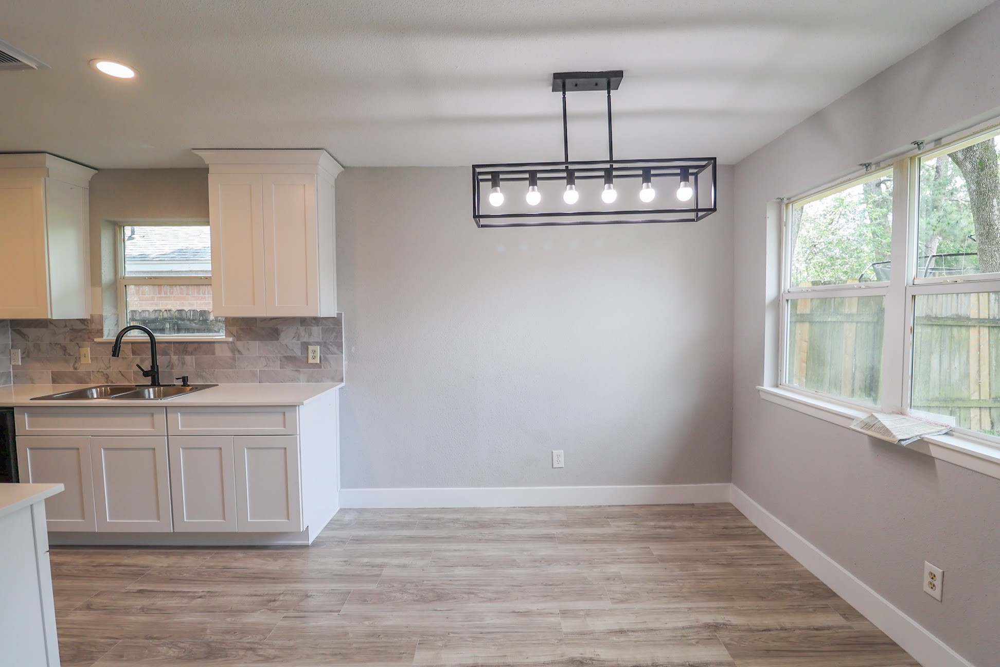 5027 Monteith Drive Spring, TX 77373 - Photo 9 of 28 a view of a kitchen with a sink cabinets and wooden floor