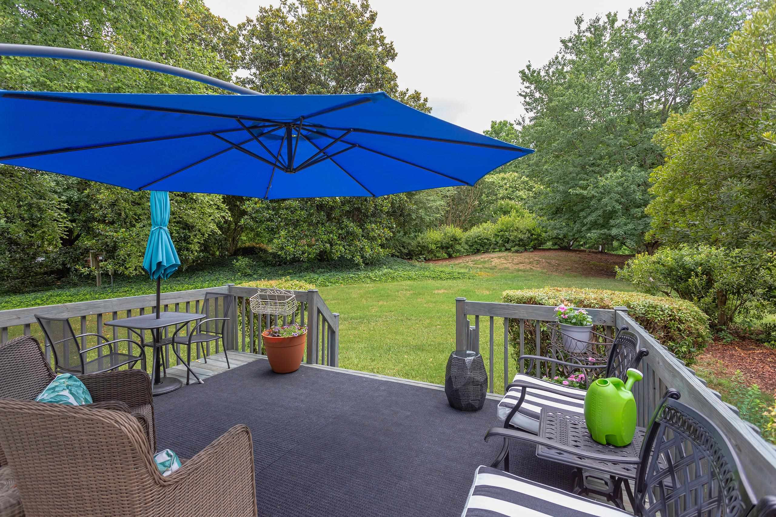 2913 Hawtree Drive Raleigh, NC 27613 - Photo 25 of 28 Sunny back deck is a wonderful spot to relax or socialize with friends and neighbors. Back Deck
