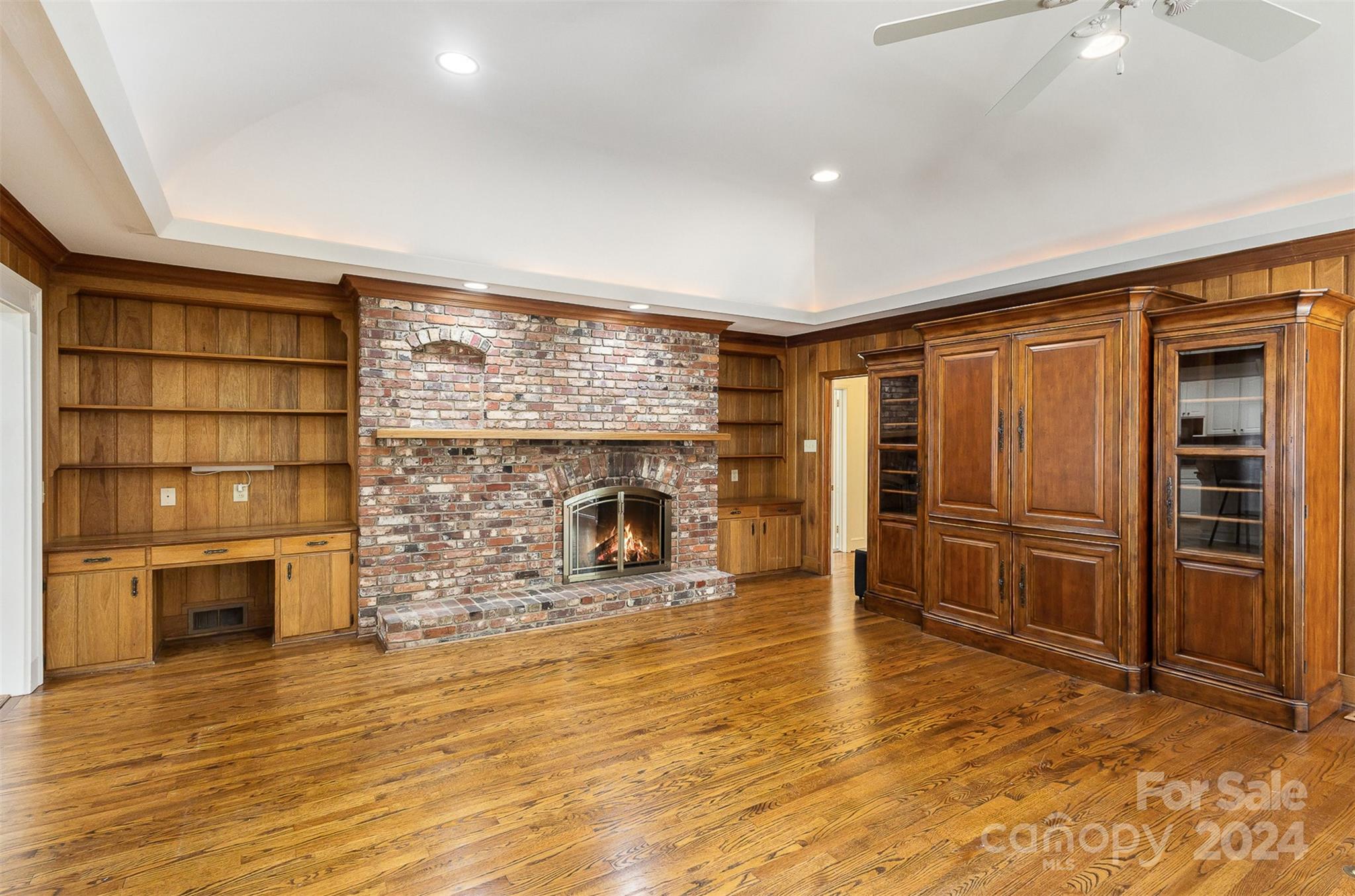 3524 Highview Road Charlotte, NC 28210 - Photo 12 of 34 wooden floor in an empty room with a fireplace