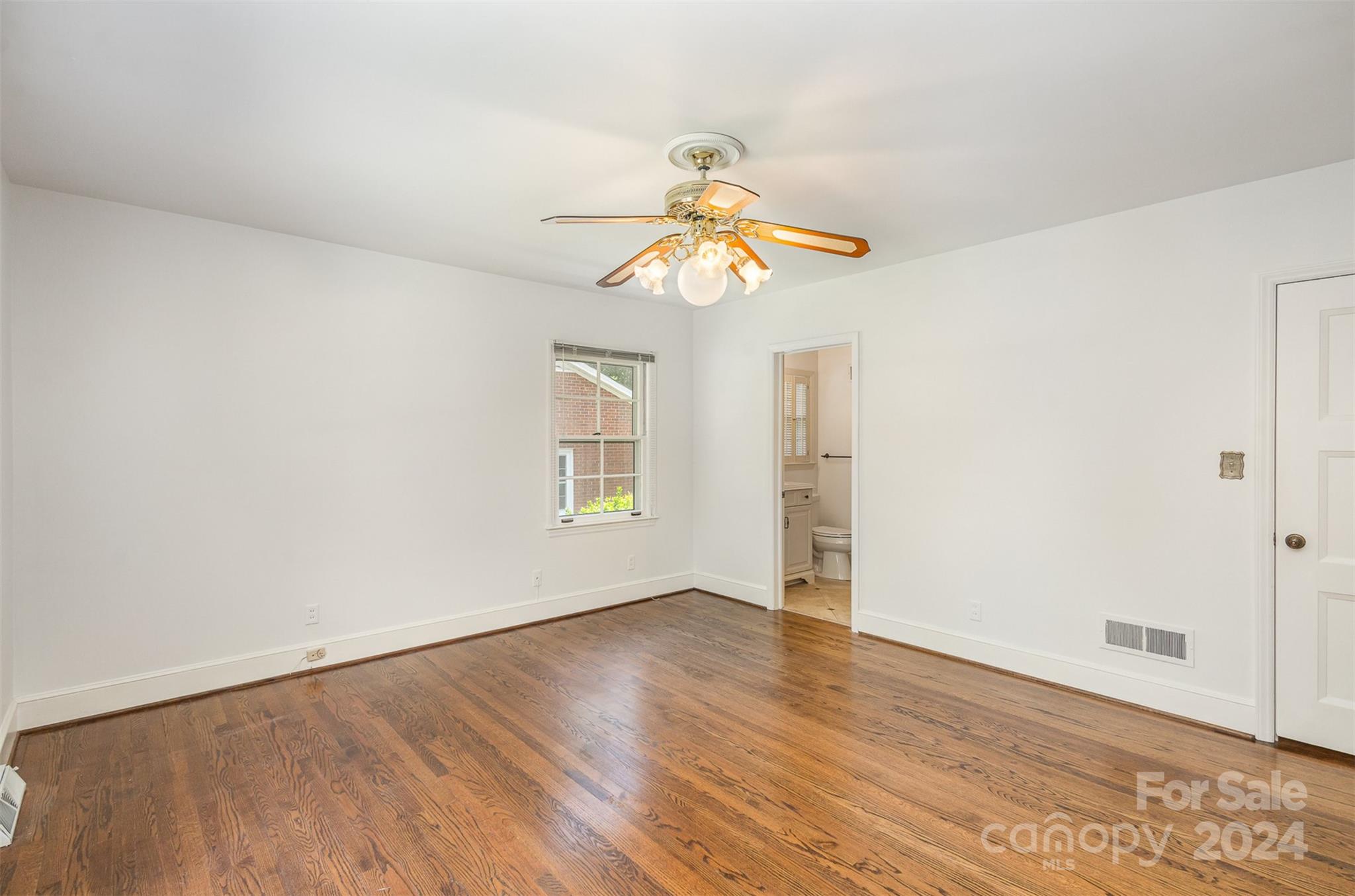 3524 Highview Road Charlotte, NC 28210 - Photo 19 of 34 wooden floor in an empty room with a window