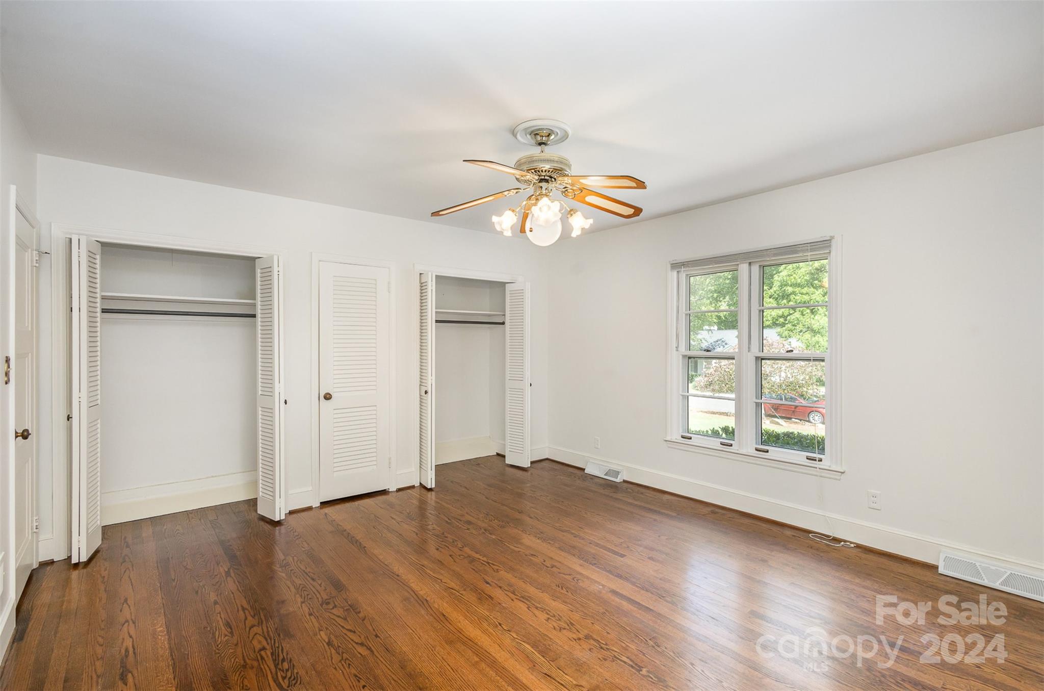 3524 Highview Road Charlotte, NC 28210 - Photo 22 of 34 a view of an empty room with window and wooden floor