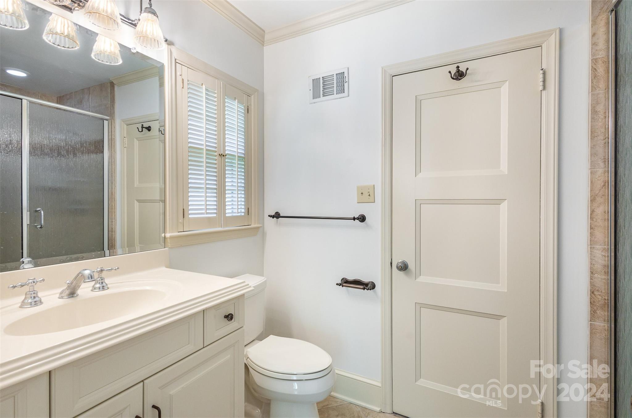 3524 Highview Road Charlotte, NC 28210 - Photo 27 of 34 a bathroom with a granite countertop sink toilet and shower