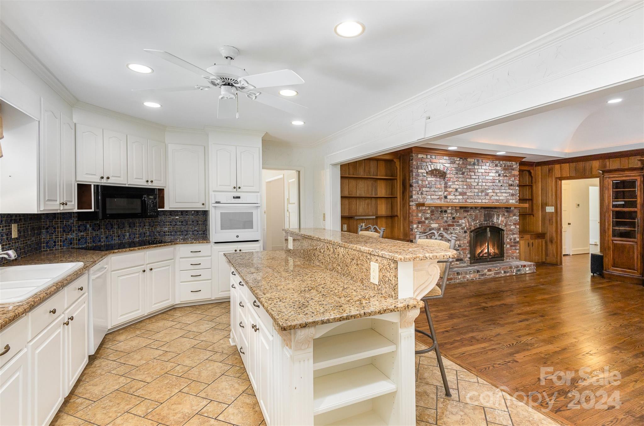 3524 Highview Road Charlotte, NC 28210 - Photo 8 of 34 a large kitchen with granite countertop a large counter top and stainless steel appliances