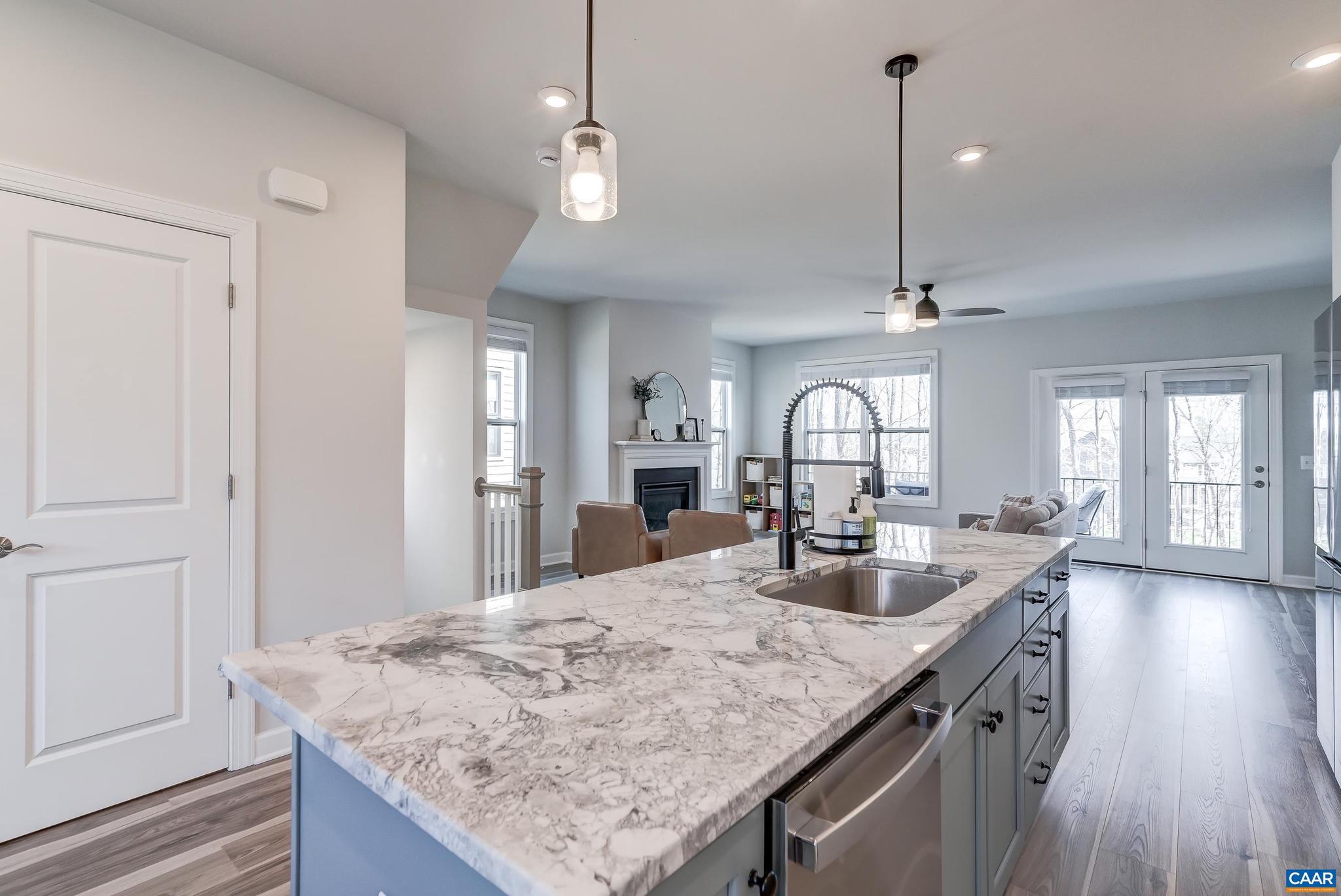 1816 Fowler Street Charlottesville, VA 22901 - Photo 12 of 51 a kitchen with sink cabinets and chandelier