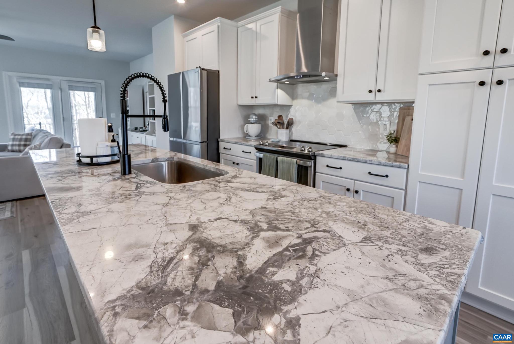 1816 Fowler Street Charlottesville, VA 22901 - Photo 13 of 51 a kitchen with granite countertop a refrigerator stove top oven and sink