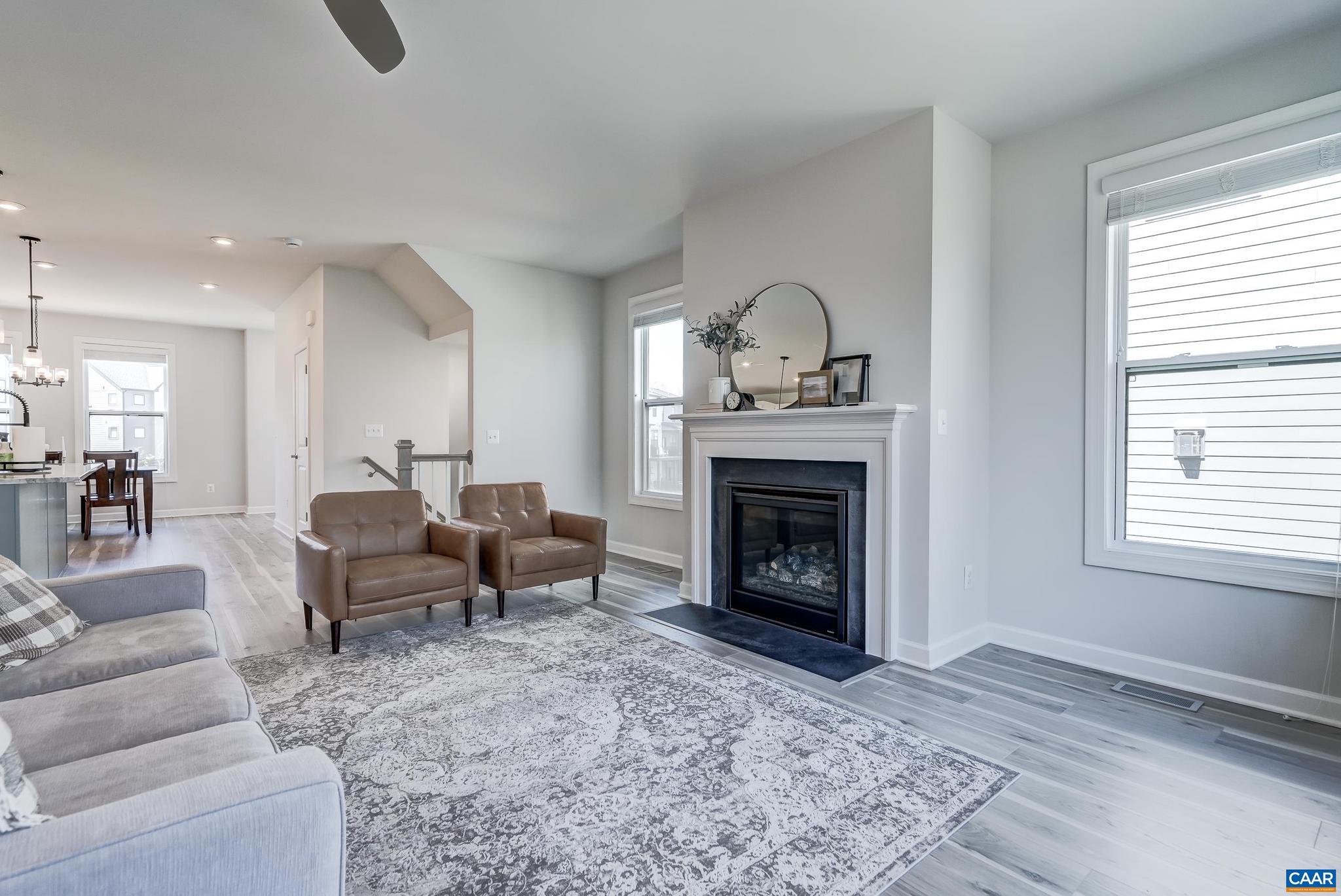 1816 Fowler Street Charlottesville, VA 22901 - Photo 14 of 51 a living room with furniture a window and a fireplace