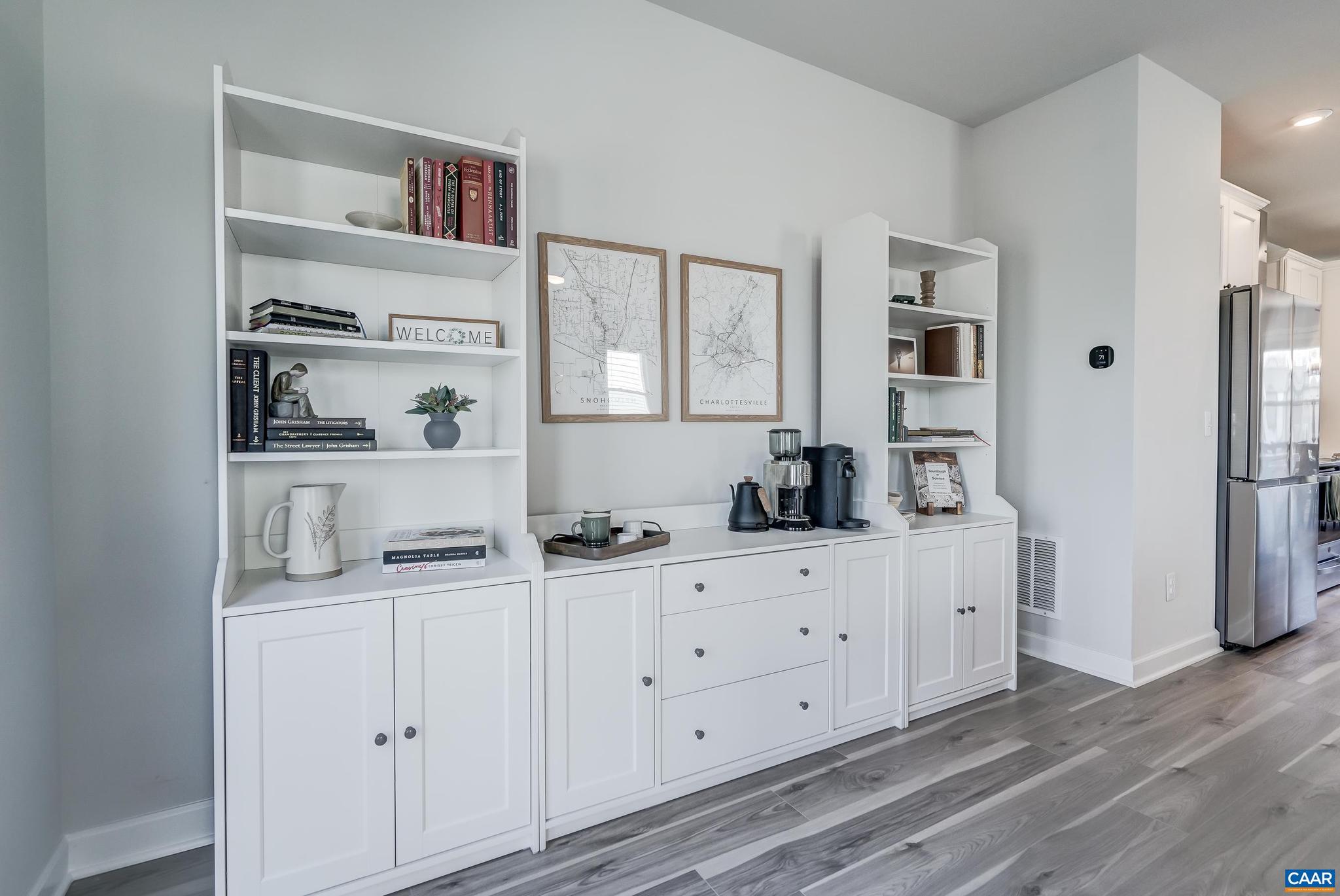 1816 Fowler Street Charlottesville, VA 22901 - Photo 17 of 51 a kitchen with white cabinets and wooden floor