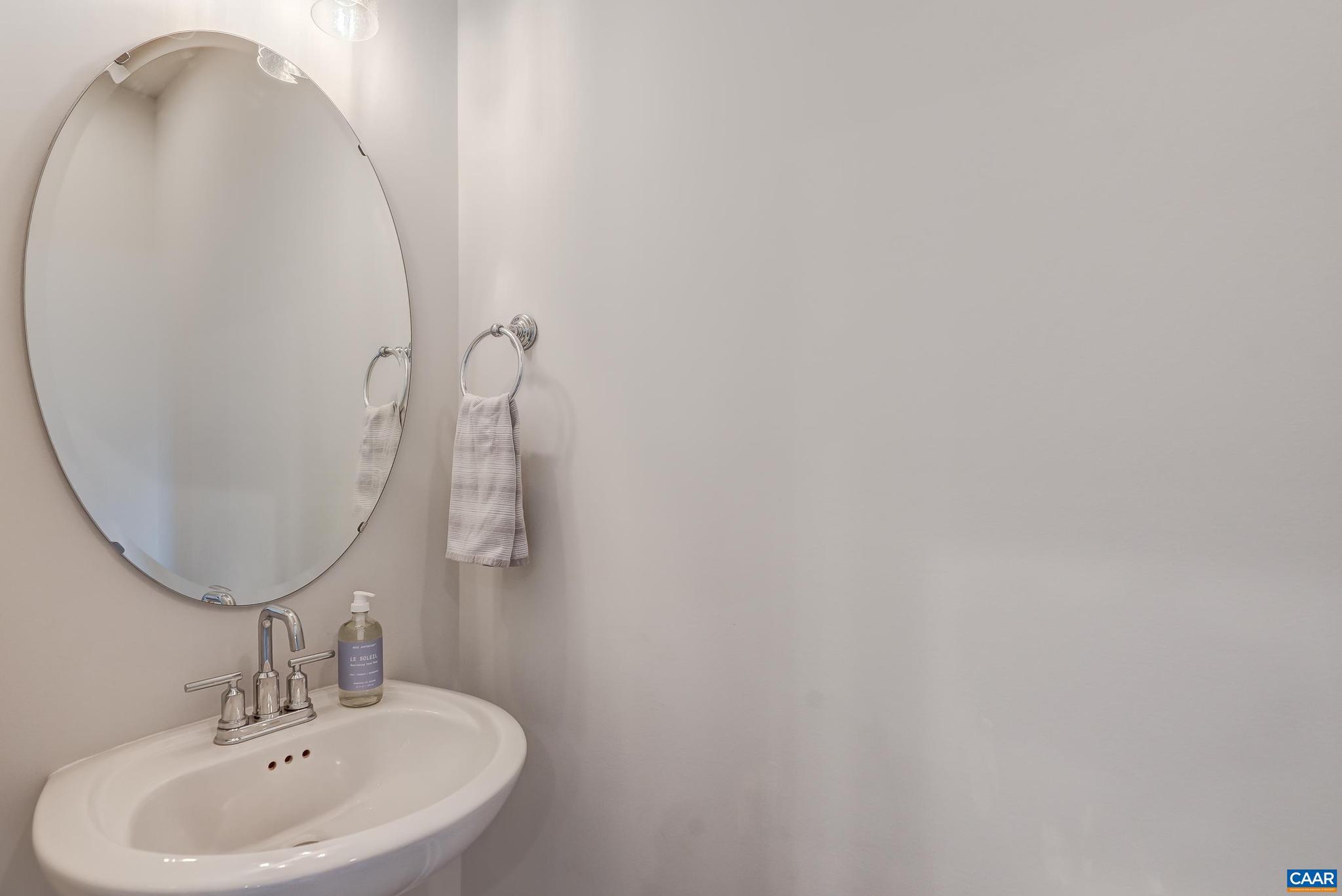 1816 Fowler Street Charlottesville, VA 22901 - Photo 21 of 51 a bathroom with a sink and mirror