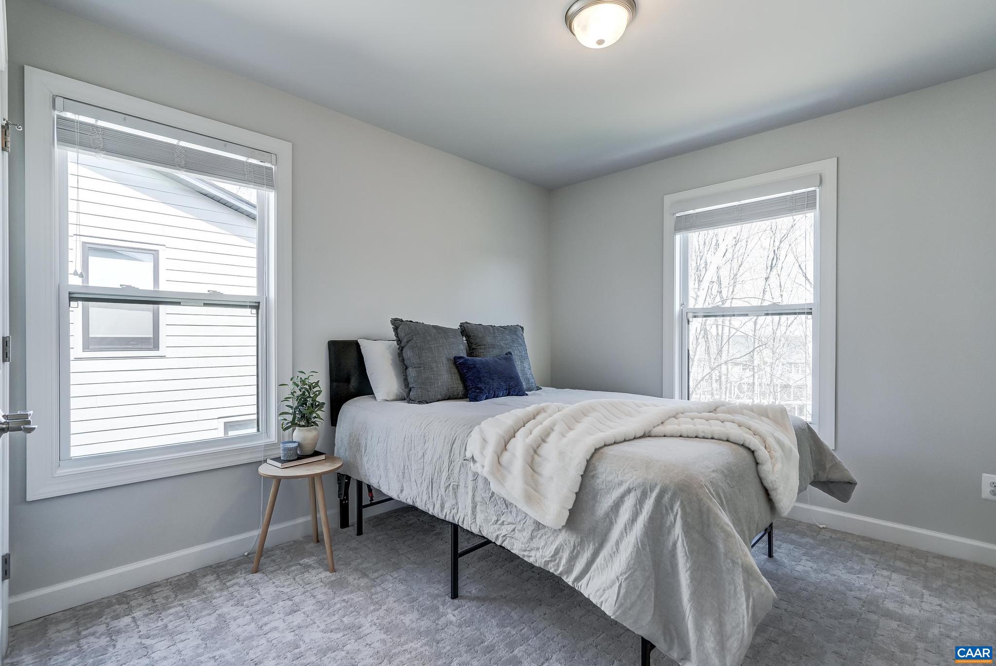 1816 Fowler Street Charlottesville, VA 22901 - Photo 27 of 51 a bedroom with a bed and a window