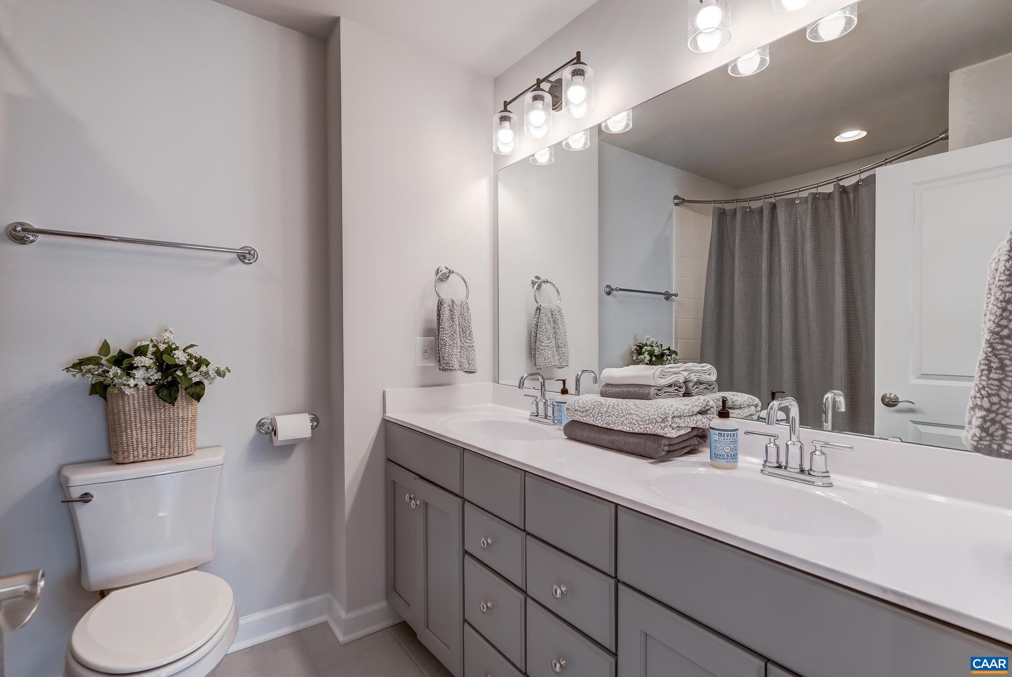 1816 Fowler Street Charlottesville, VA 22901 - Photo 28 of 51 a bathroom with a toilet sink and mirror