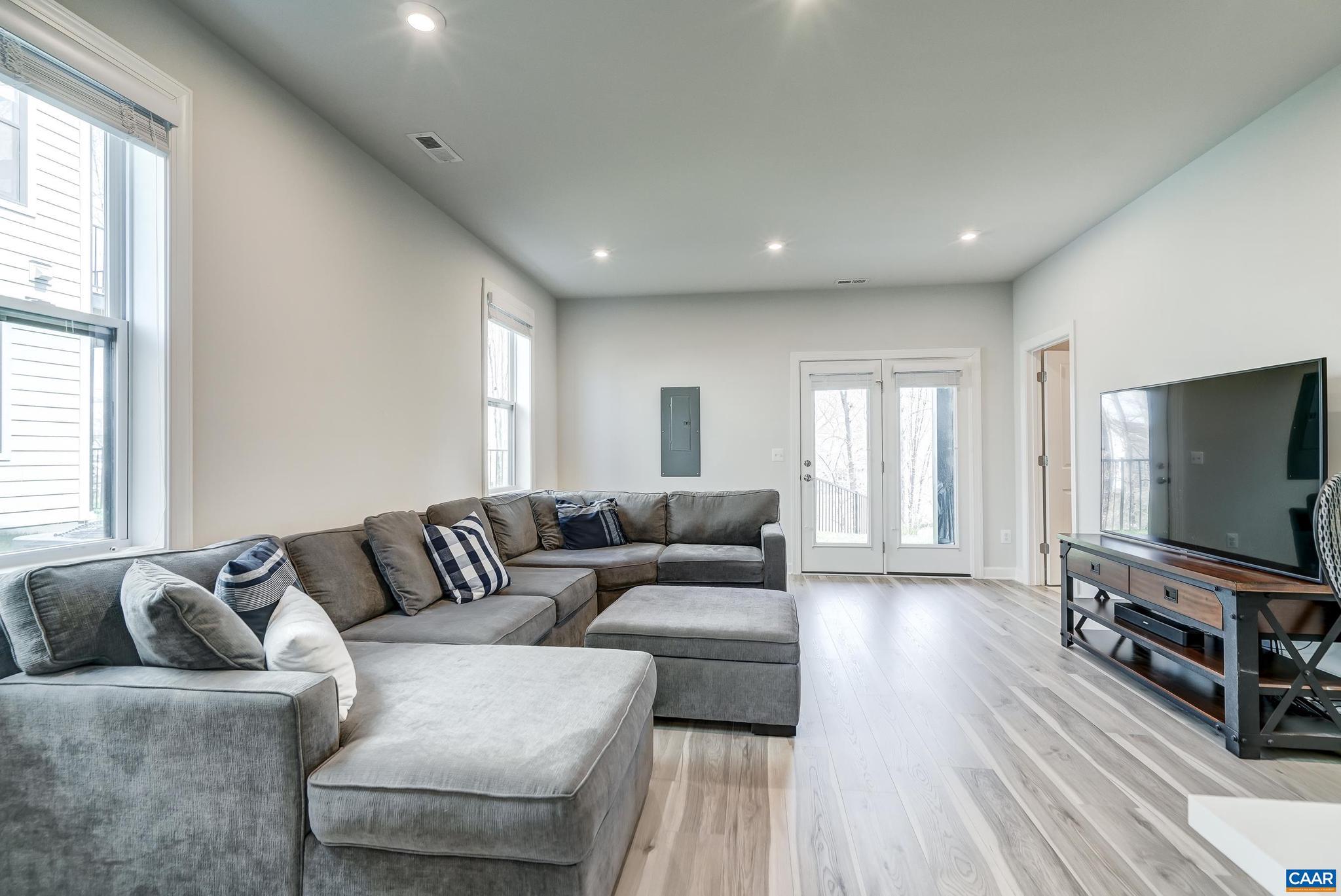 1816 Fowler Street Charlottesville, VA 22901 - Photo 31 of 51 a living room with furniture and a flat screen tv