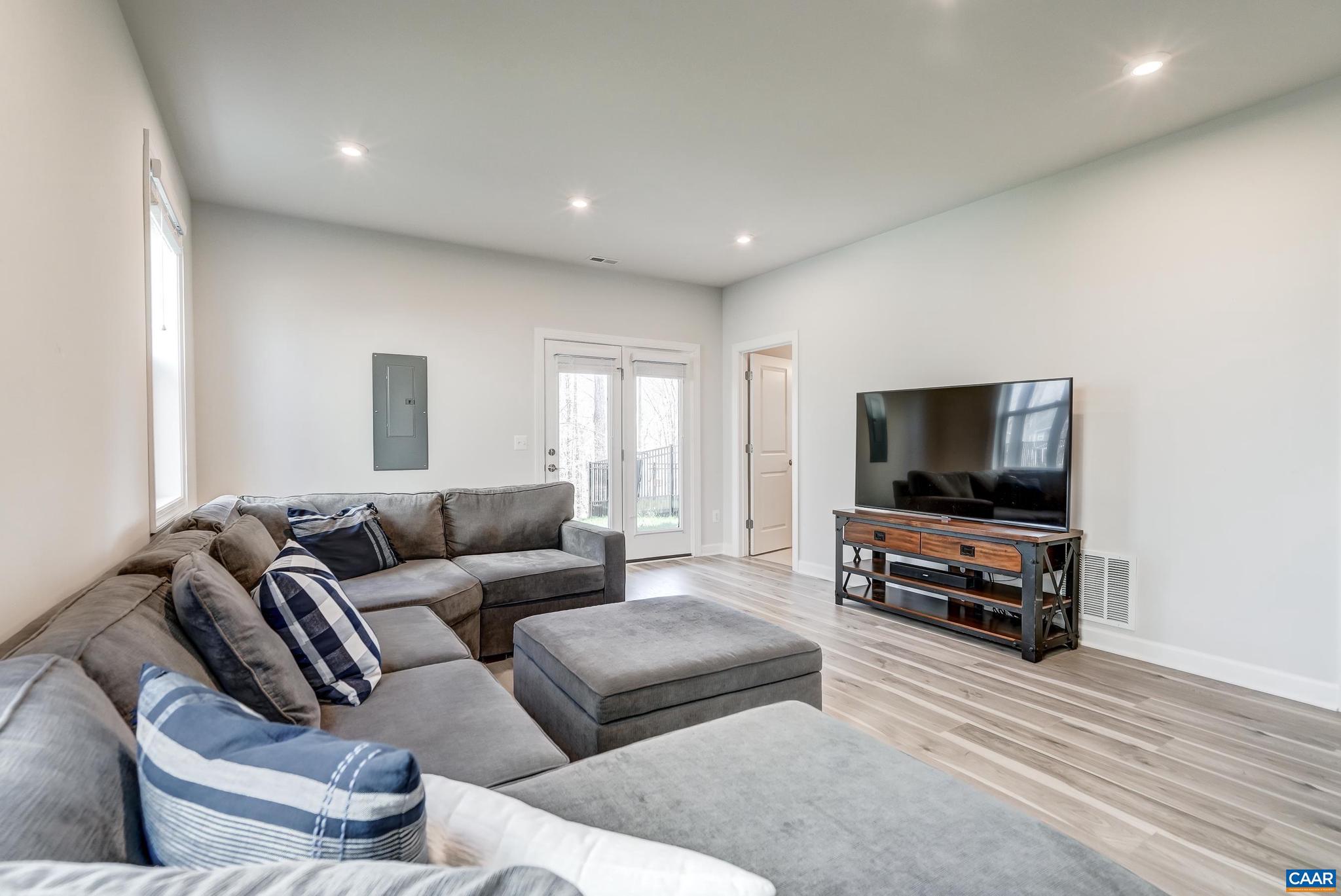1816 Fowler Street Charlottesville, VA 22901 - Photo 32 of 51 a living room with furniture and a flat screen tv
