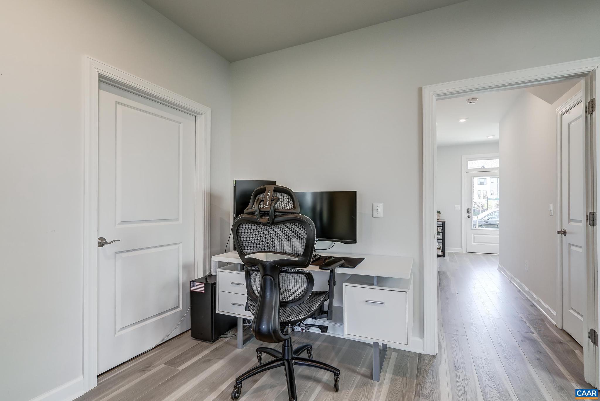 1816 Fowler Street Charlottesville, VA 22901 - Photo 34 of 51 a view of a workspace with wooden floor