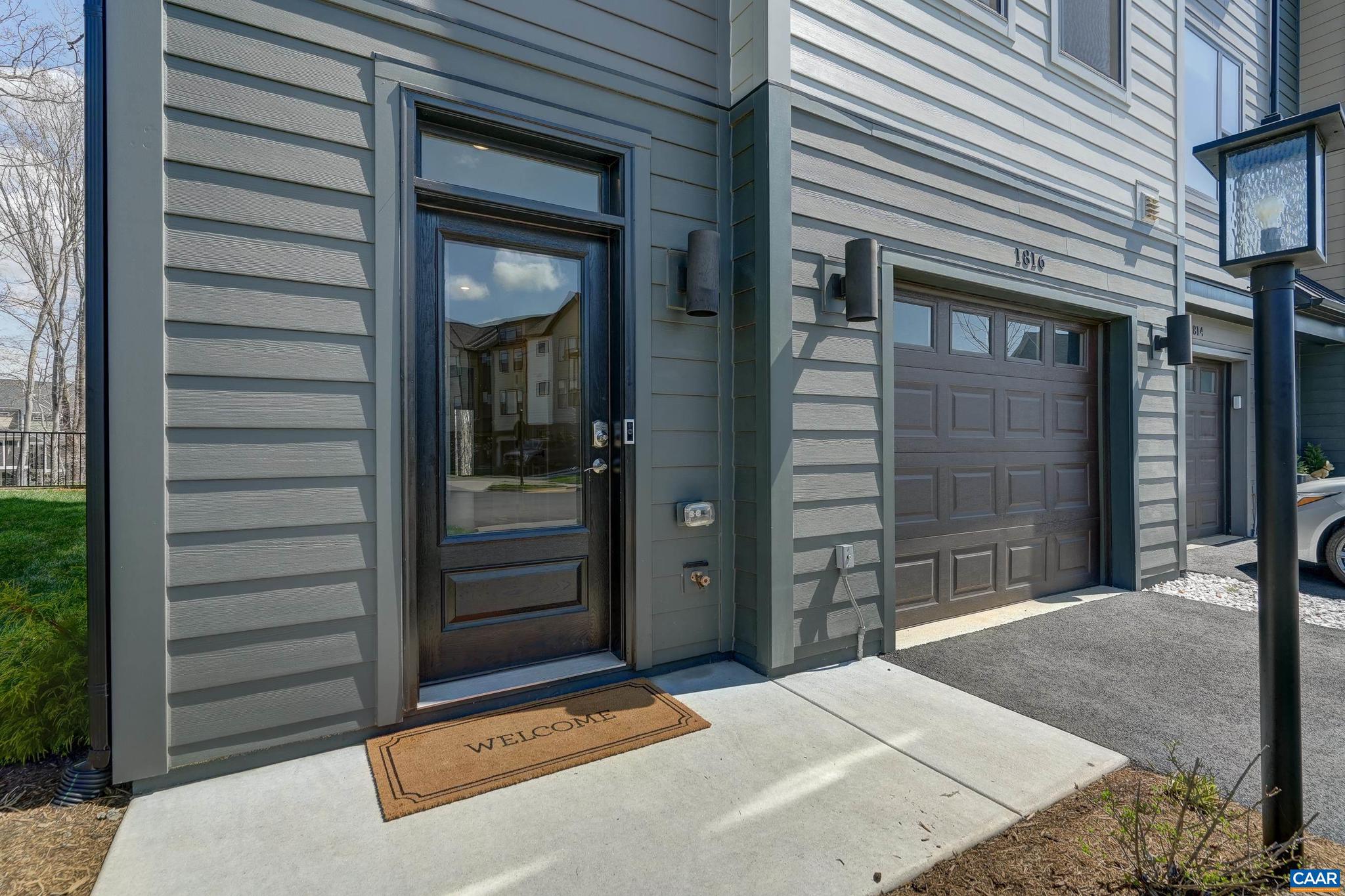1816 Fowler Street Charlottesville, VA 22901 - Photo 5 of 51 a backyard of a house with barbeque oven and brick wall
