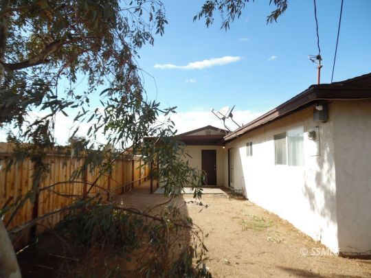 1612 South Yorktown Street Ridgecrest, CA 93555 - Photo 24 of 26 a view of a house with a yard