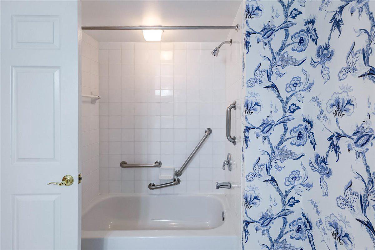 12330 Rosslare Ridge Road, Unit 406 Lutherville-Timonium, MD 21093 - Photo 29 of 37 Hall bath w/tub & shower & safety handrails