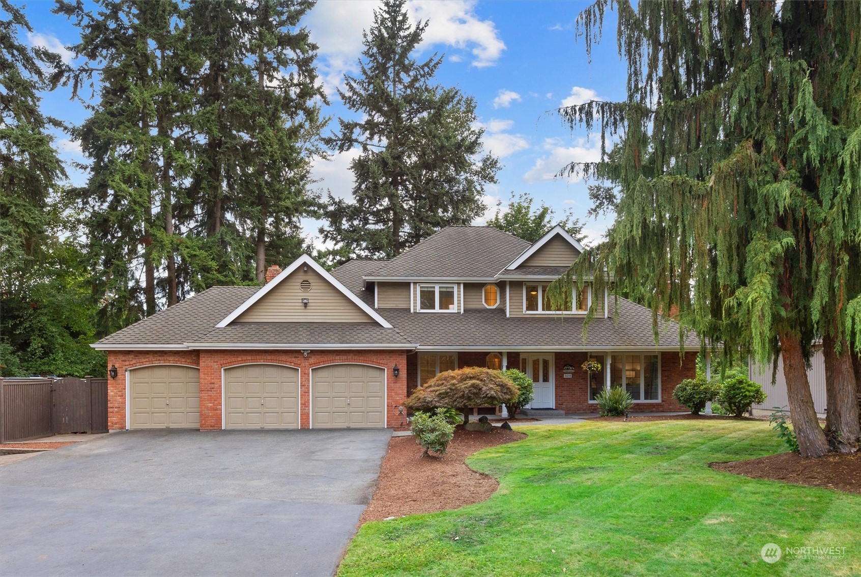 3014 184th Place Southeast Bothell, WA 98012 - Photo 1 of 36 a front view of a house with garden