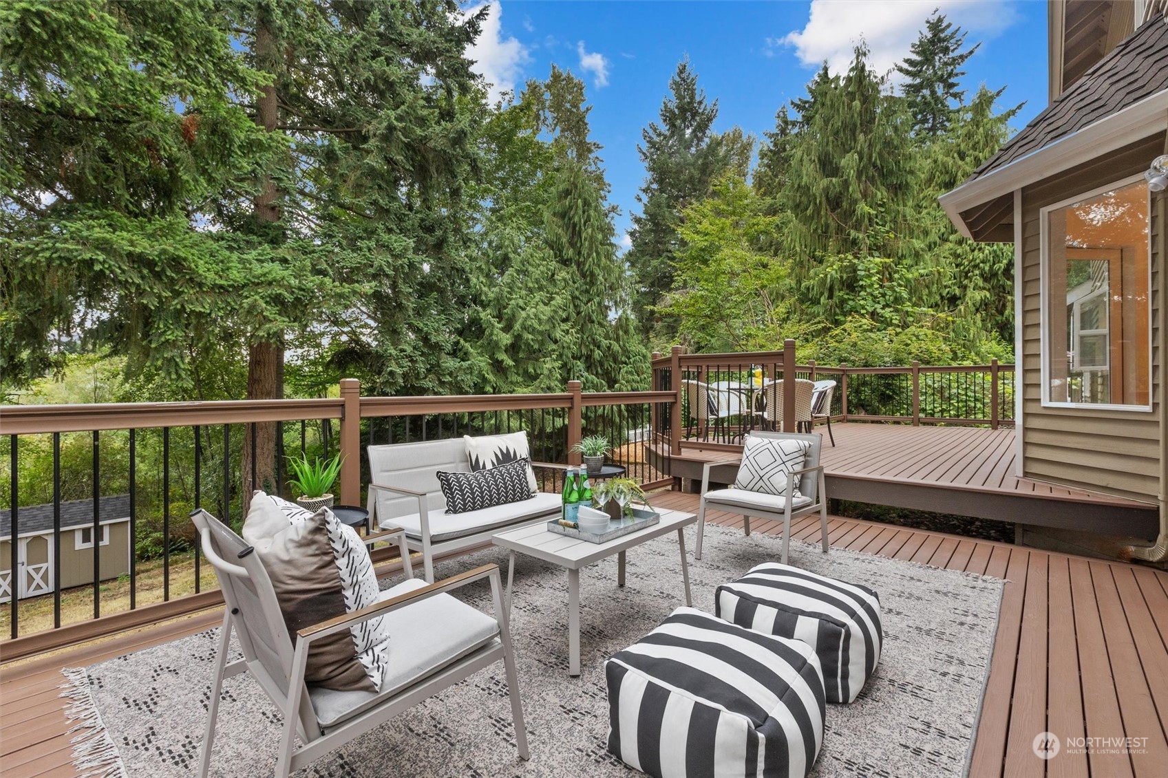 3014 184th Place Southeast Bothell, WA 98012 - Photo 24 of 36 a view of a patio with couches chairs and wooden floor