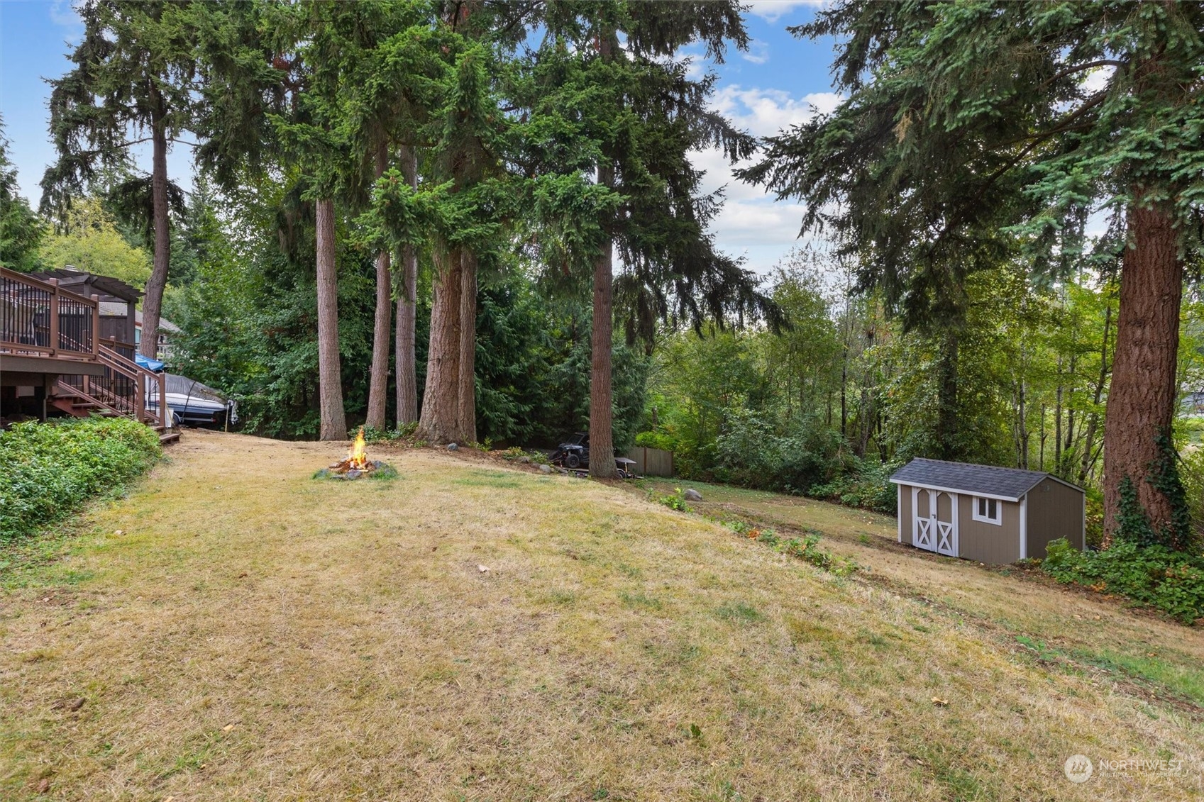 3014 184th Place Southeast Bothell, WA 98012 - Photo 25 of 36 a view of a house with a yard and large trees