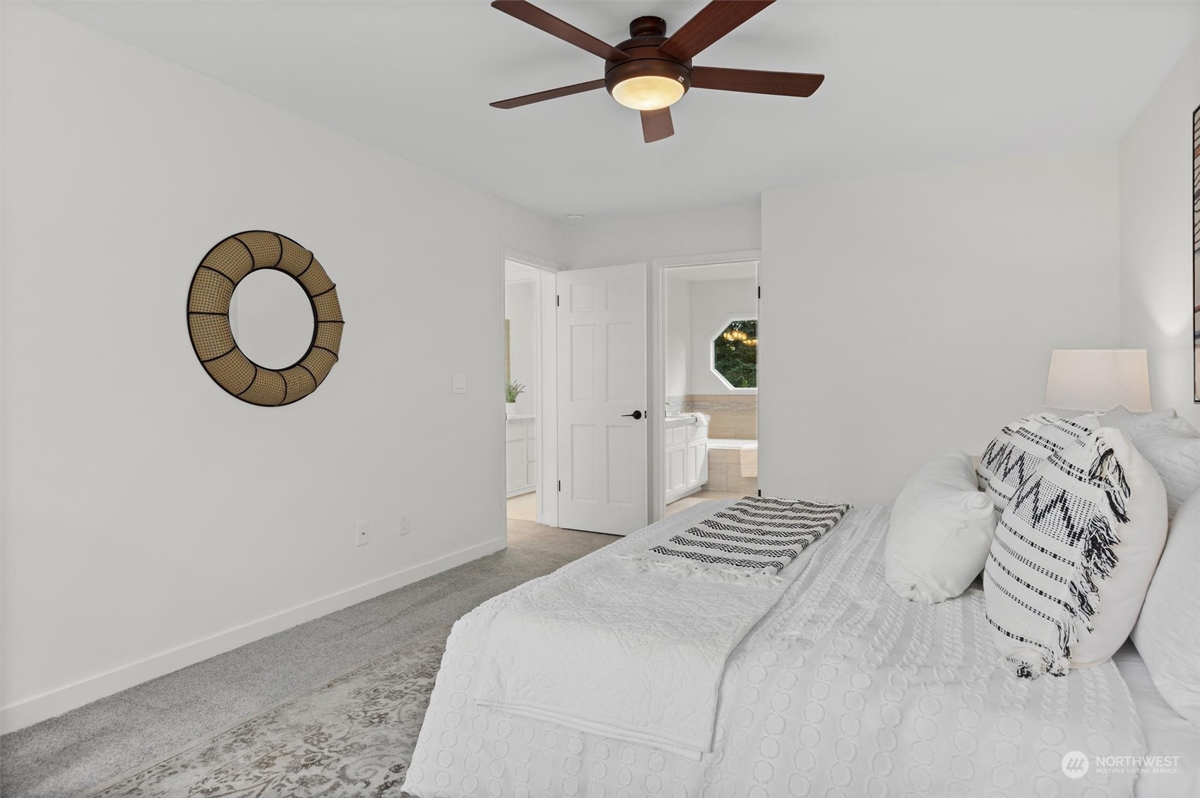 3014 184th Place Southeast Bothell, WA 98012 - Photo 27 of 36 a bedroom with a bed and a chandelier