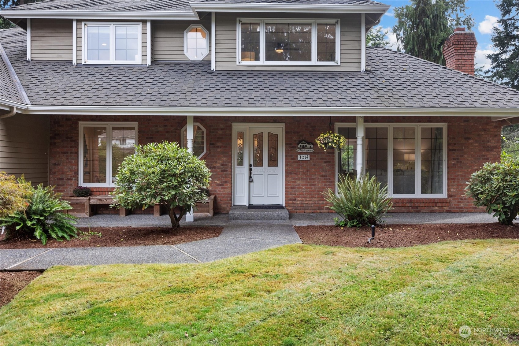 3014 184th Place Southeast Bothell, WA 98012 - Photo 4 of 36 a front view of a house with a yard and garage