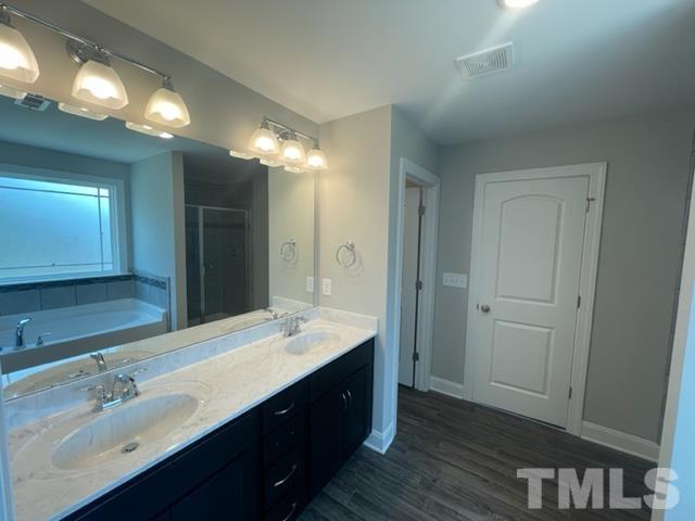 24 Star Valley Dr. Valley Angier, NC 27501 - Photo 11 of 23 a bathroom with a double vanity sink and a mirror