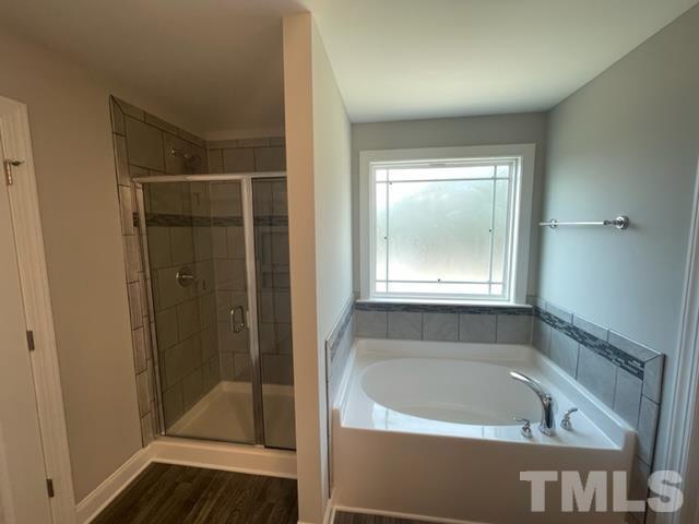 24 Star Valley Dr. Valley Angier, NC 27501 - Photo 12 of 23 a bath tub sitting in a bathroom next to a window