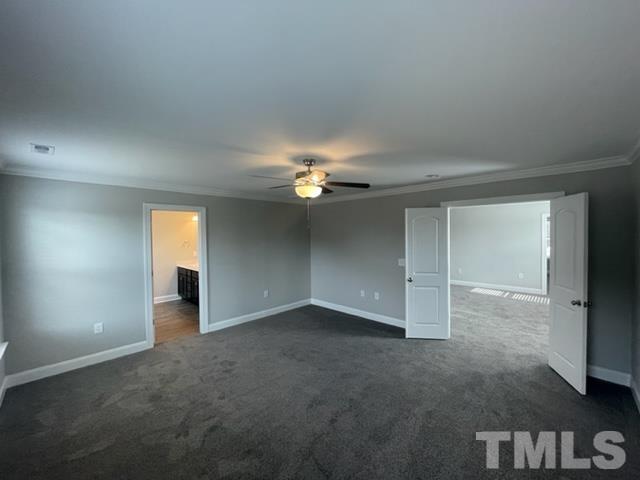 24 Star Valley Dr. Valley Angier, NC 27501 - Photo 14 of 23 an empty room with a ceiling fan and a window
