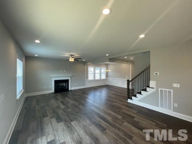 24 Star Valley Dr. Valley Angier, NC 27501 - Photo 19 of 23 a view of an empty room with wooden floor and a window