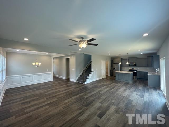 24 Star Valley Dr. Valley Angier, NC 27501 - Photo 20 of 23 a view of a livingroom with furniture wooden floor and a ceiling fan