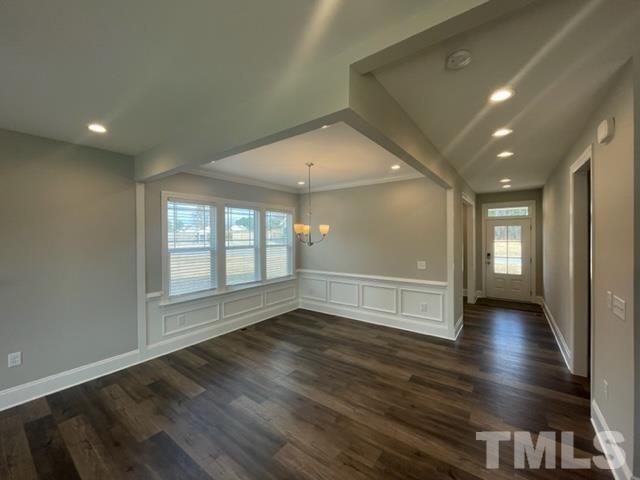 24 Star Valley Dr. Valley Angier, NC 27501 - Photo 21 of 23 an empty room with wooden floor and windows