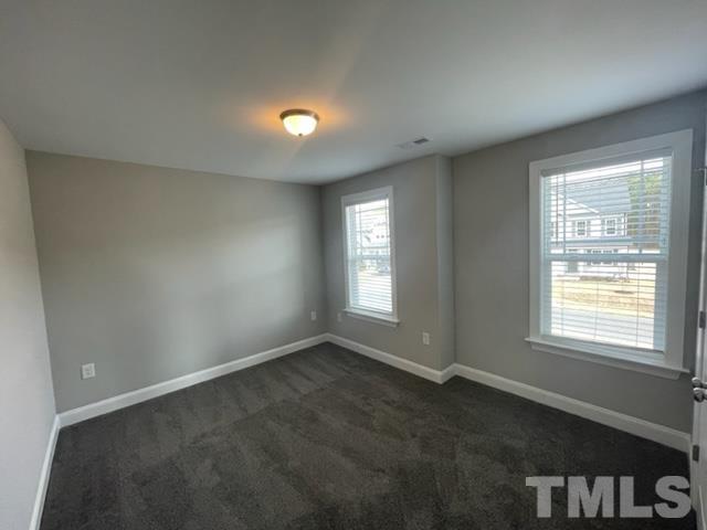 24 Star Valley Dr. Valley Angier, NC 27501 - Photo 7 of 23 an empty room with a empty space and windows