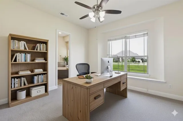 a view of workspace with a window and cabinet