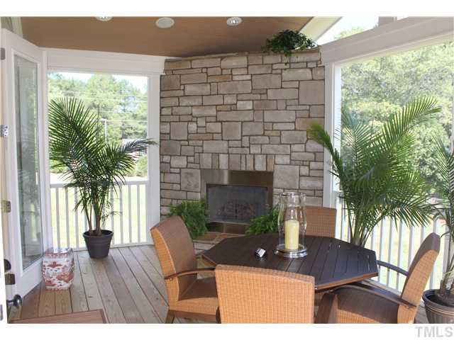 With amazing stone fireplace recessed overhead lighting. Screened Porch