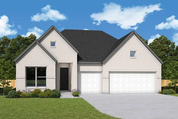a front view of a house with a garden and yard