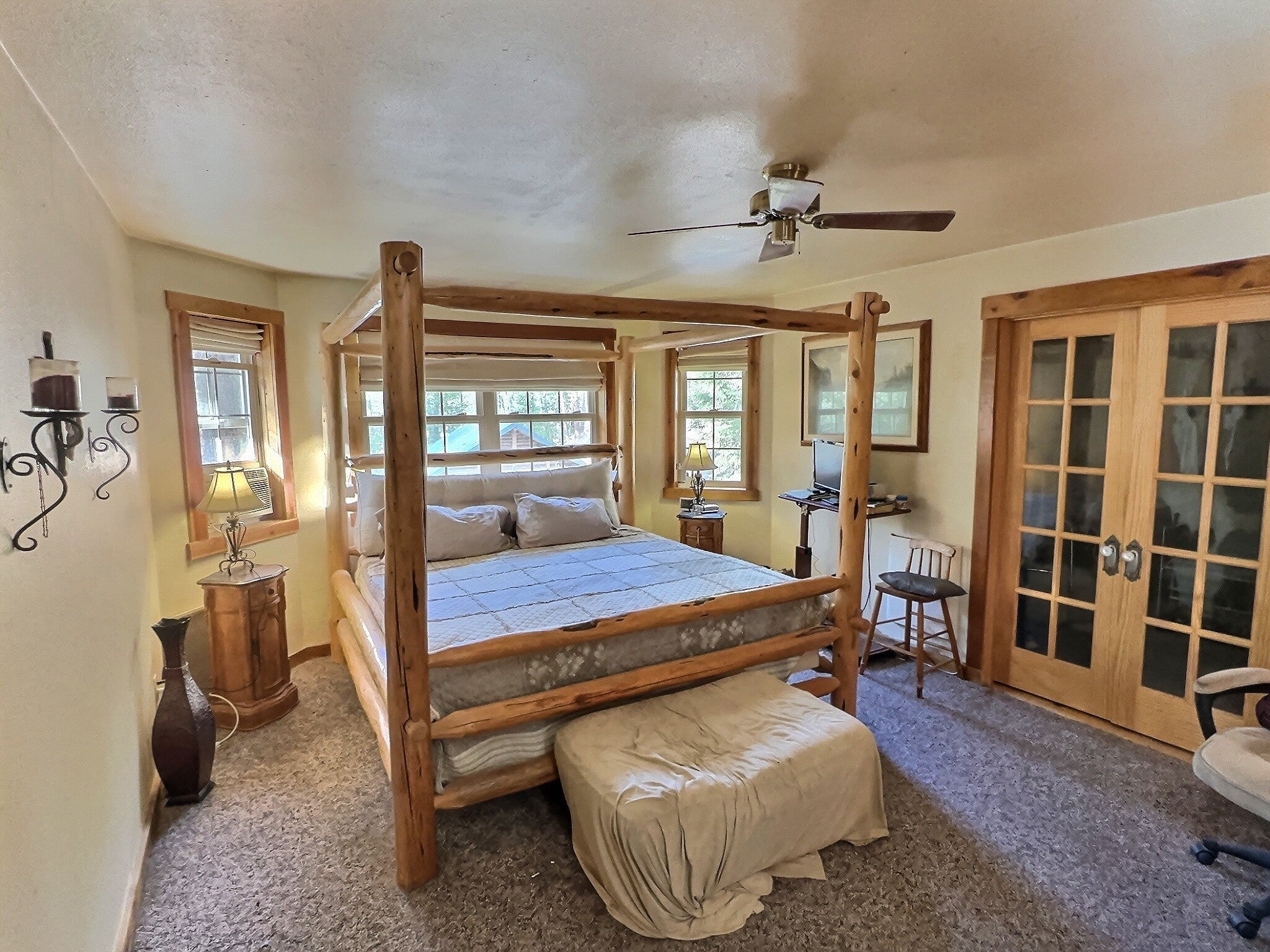 152 Buffalo Bill Road Plains, MT 59859 - Photo 39 of 71 Bedroom featuring ceiling fan, carpet flooring, and a textured ceiling