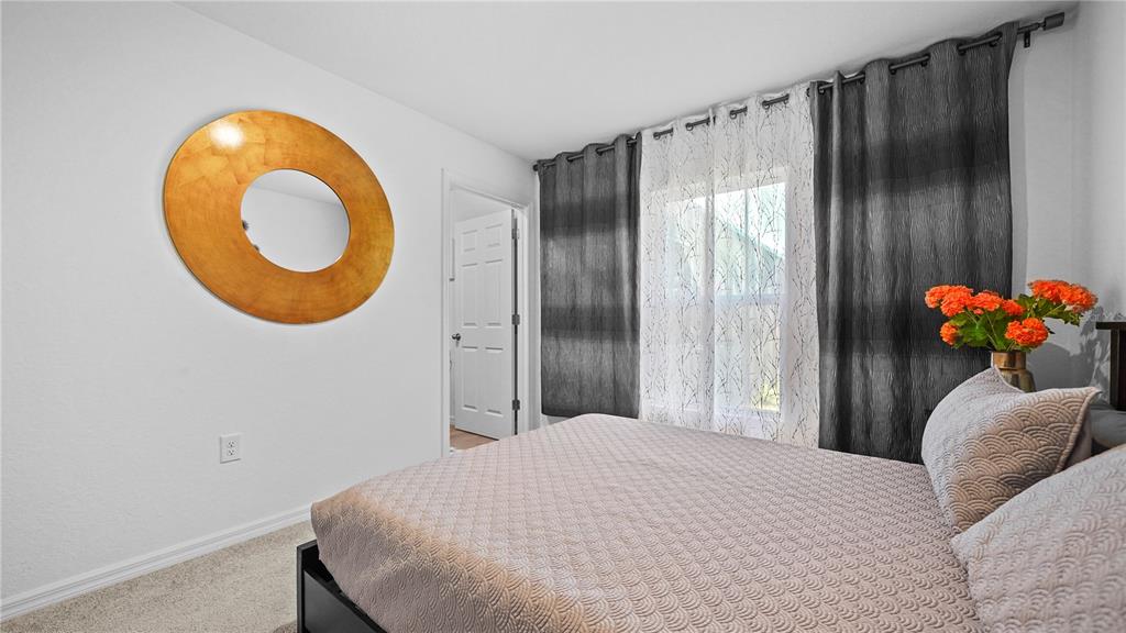 1477 Winthrop Street North Port, FL 34288 - Photo 18 of 100 a bedroom with a bed and a chair