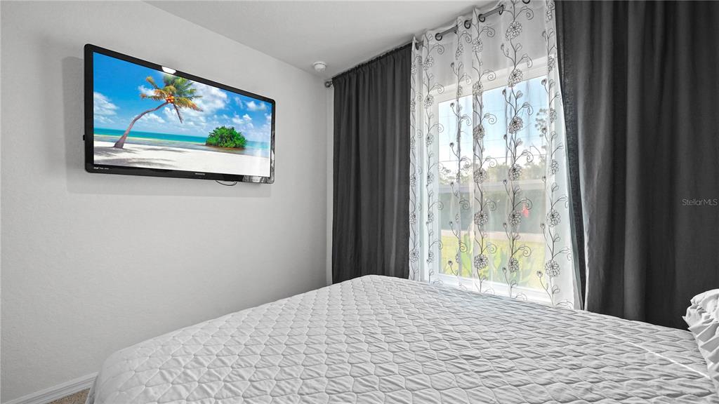 1477 Winthrop Street North Port, FL 34288 - Photo 22 of 100 a bedroom with a bed and a painting on the wall