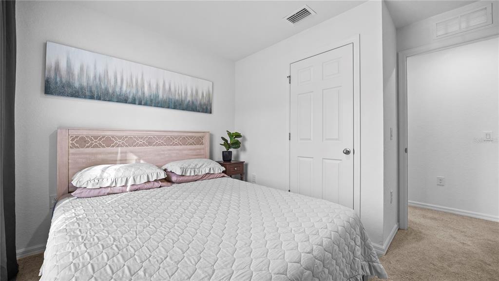 1477 Winthrop Street North Port, FL 34288 - Photo 28 of 100 a bedroom with a bed and a window