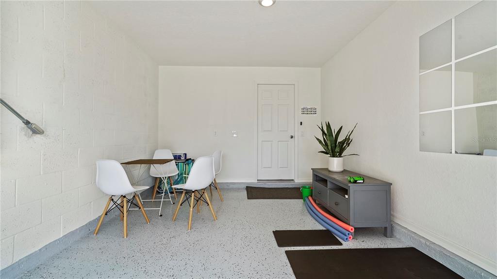 1477 Winthrop Street North Port, FL 34288 - Photo 32 of 100 a room with furniture and a potted plant