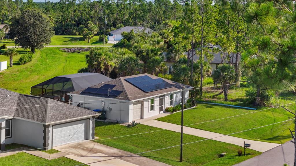 1477 Winthrop Street North Port, FL 34288 - Photo 45 of 100 a view of a house with a big yard