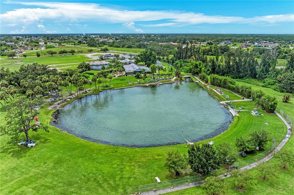 1477 Winthrop Street North Port, FL 34288 - Photo 93 of 100 an aerial view of a house with a yard and lake view