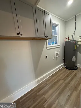 a view of a refrigerator in kitchen and wooden floor
