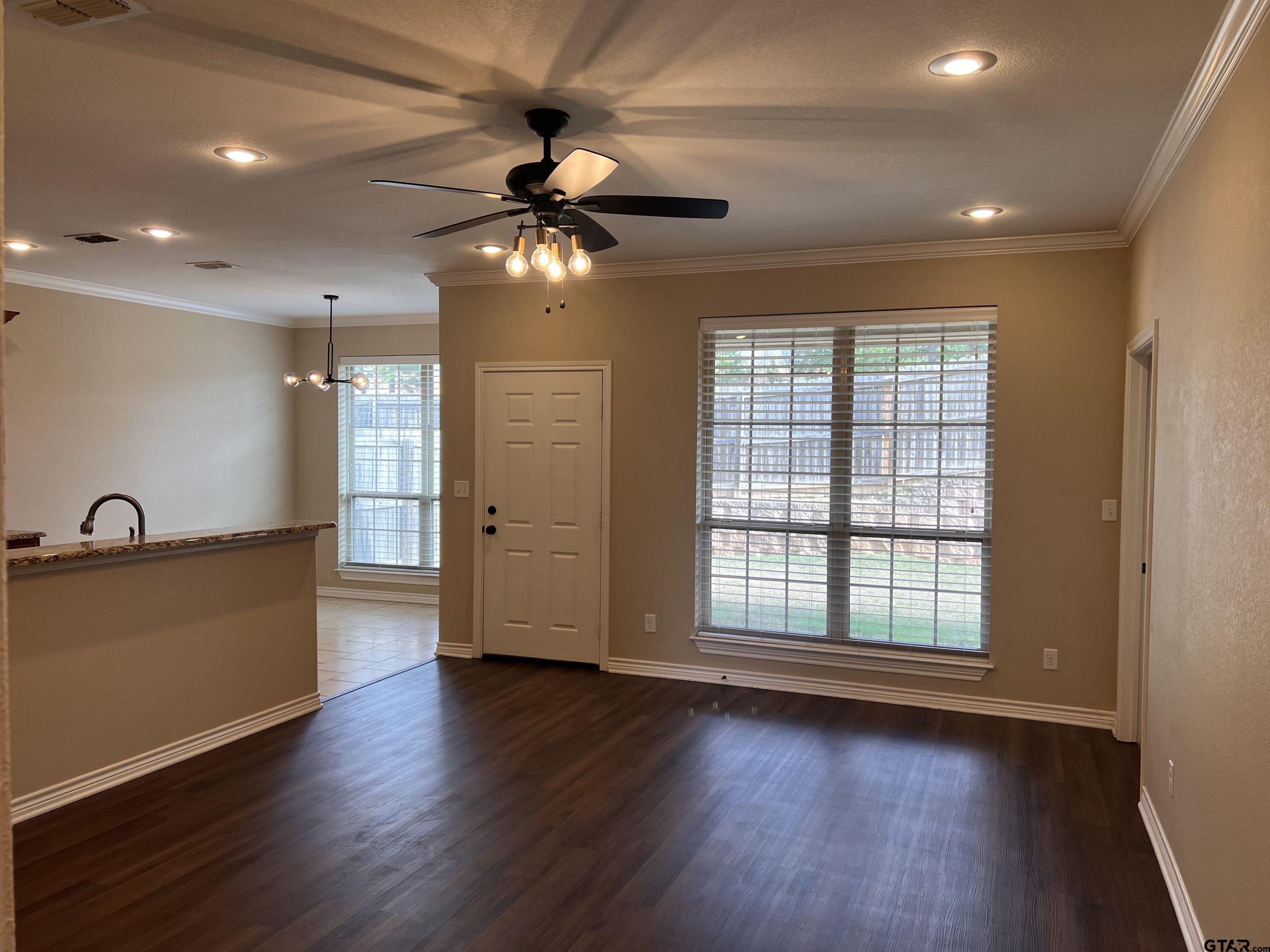 112 Letha Court Tyler, TX 75702 - Photo 14 of 45 a view of an empty room with a window and wooden floor