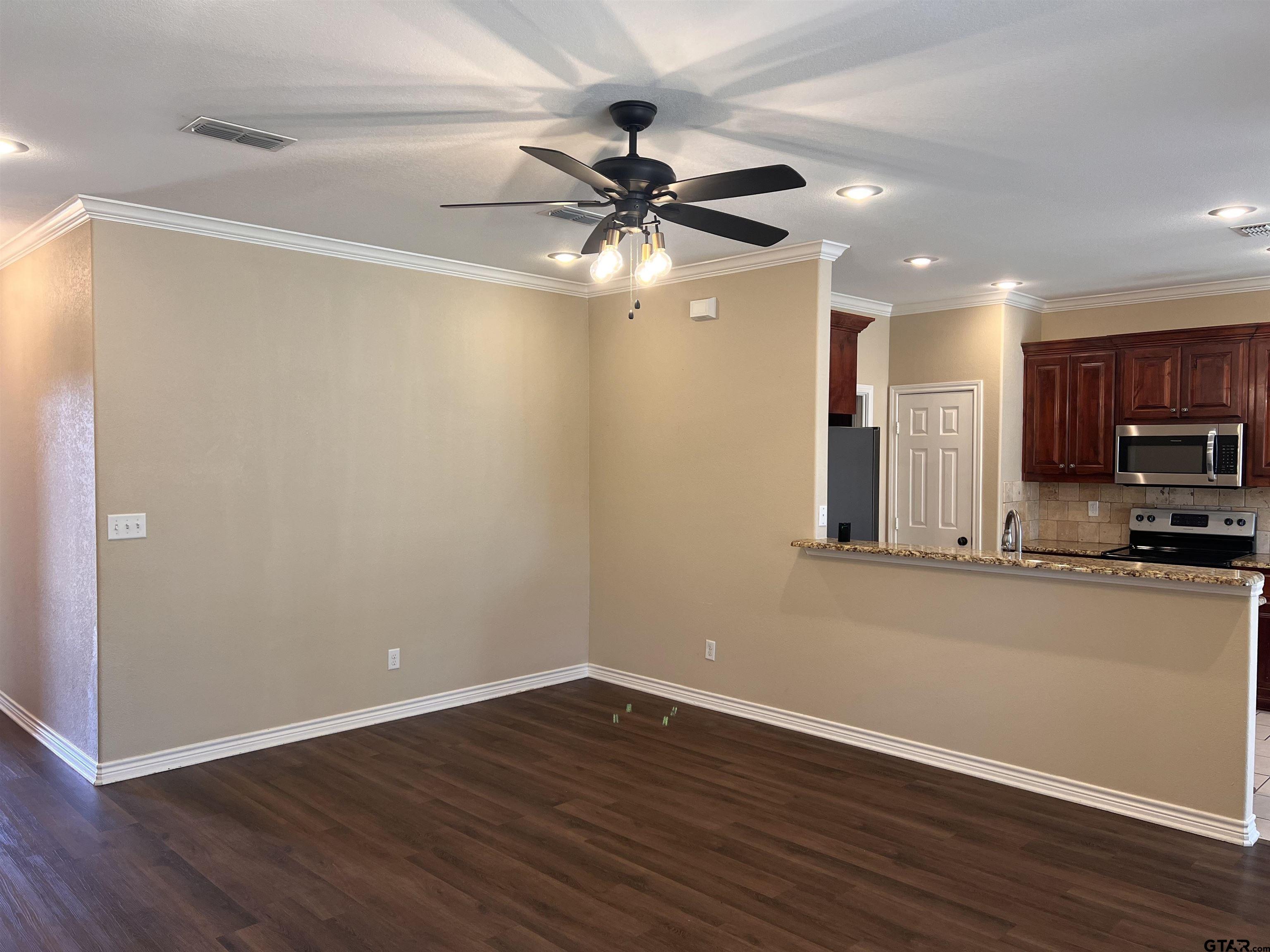 112 Letha Court Tyler, TX 75702 - Photo 28 of 45 a view of a kitchen with a sink and wooden floor